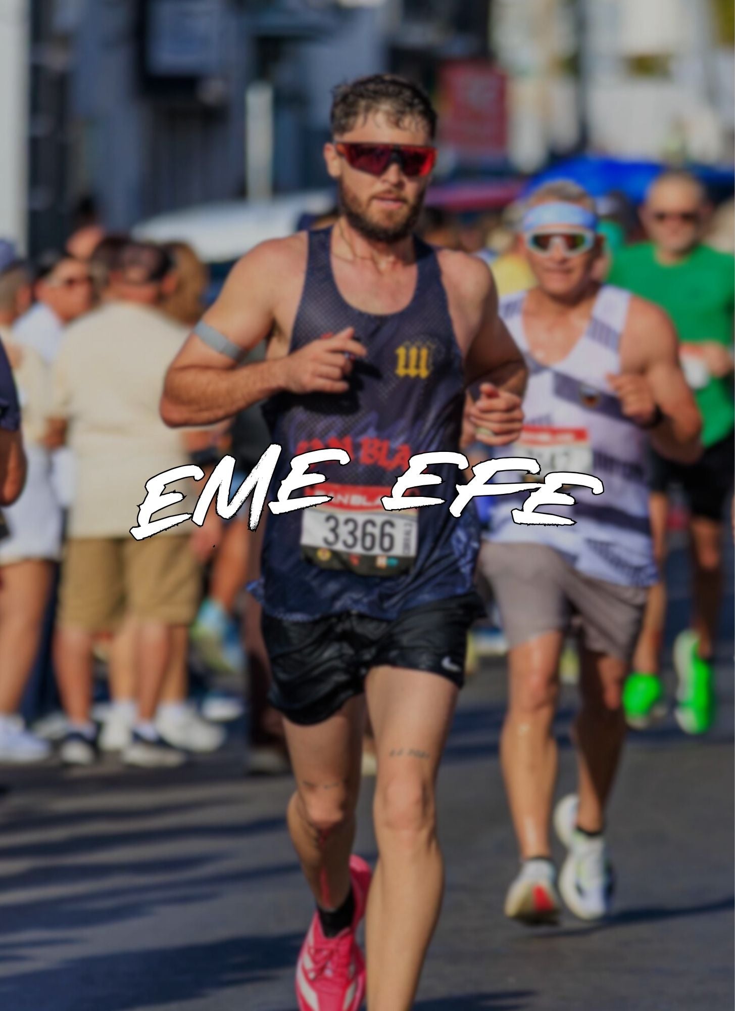 Man running in a race with eme efe racing singlet. Puerto Rico's most important half marathon in Coamo. Medio Maraton San Blas en Puerto Rico. Eme Efe text